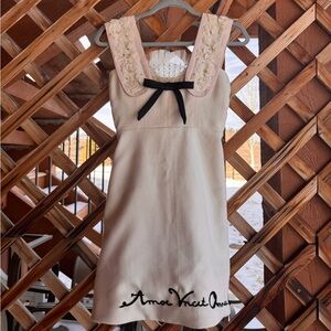 Elegant Cream Dress with Black Bow